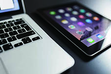 a laptop and a smart phone demonstrating the use scenarios of digital translation