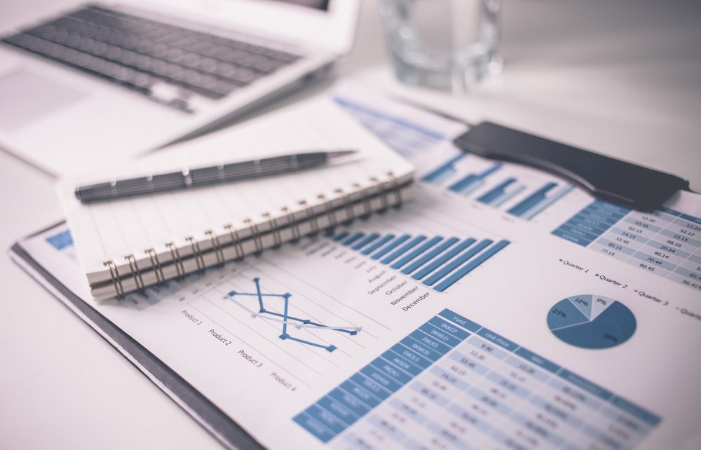 Translated financial reports on a desk.